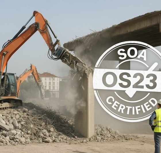 Workers and machines safely demolishing a building in Italy with an SOA OS23 certified mark.”