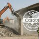 Workers and machines safely demolishing a building in Italy with an SOA OS23 certified mark.”